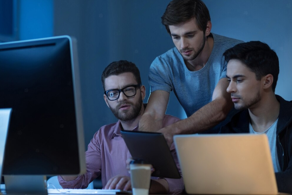 team of devs working on computers